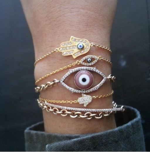Evil eye and hamsa bracelets in gold and diamonds